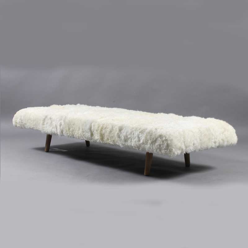 Daybed in white color with wooden legs - Deszine Talks