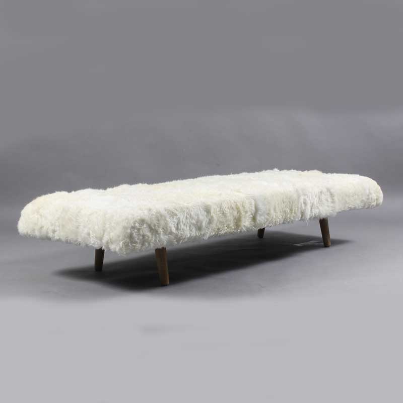 Daybed in white color with wooden legs - Deszine Talks