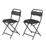A pair of folding chairs with black leather cushions.