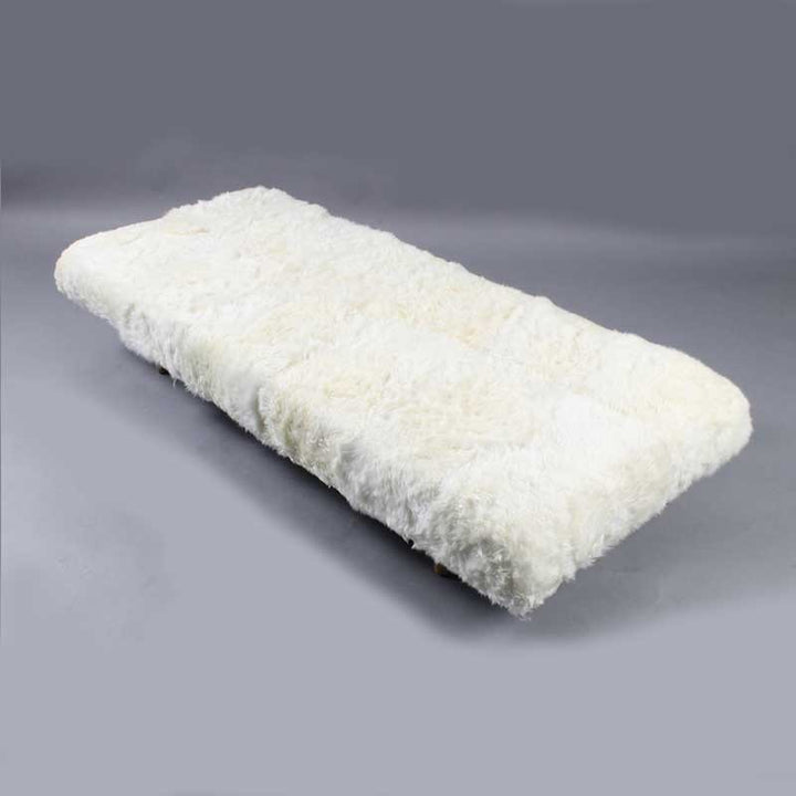 Daybed in white color with wooden legs - Deszine Talks