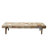 Daybed in cowhide with wooden legs - Deszine Talks